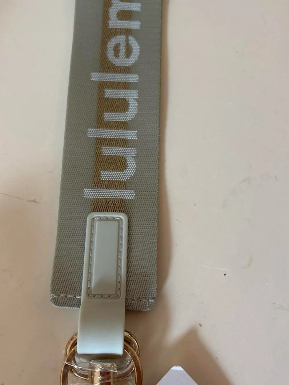 Lululemon Grey & Gold Never Lost Keychain